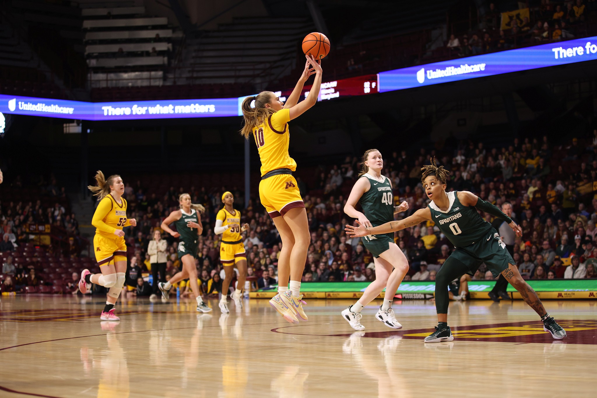 Minnesota guard Mara Braun shoots an open midrange jump shot near the elbow.