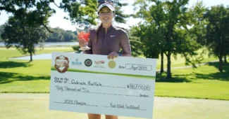 Gabi Ruffles poses with her check after winning the 2023 Four Winds Invitational.