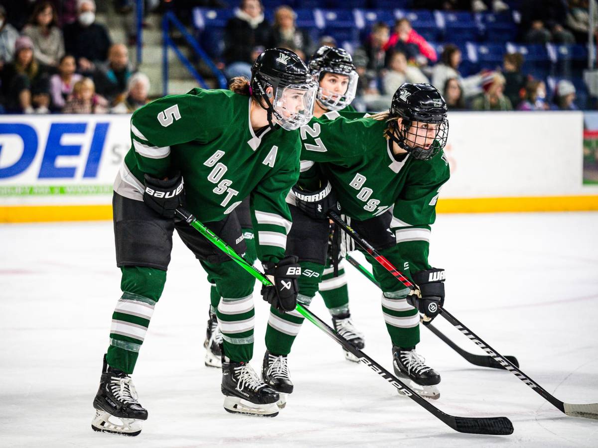 Boston players, wearing their green home uniforms, line up for a face-off during a previous game.