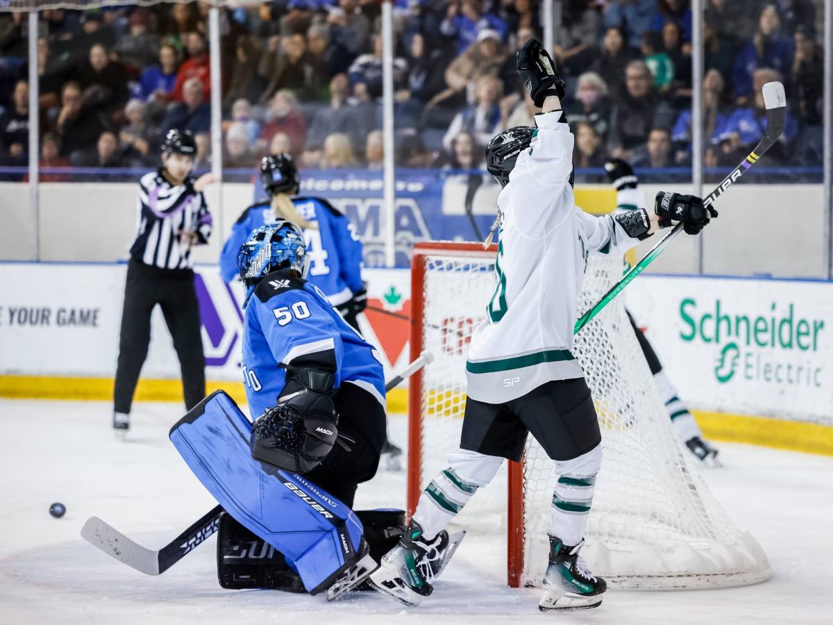 Loren Gabel, wearing a white away uniform, celebrates her goal against Toronto.