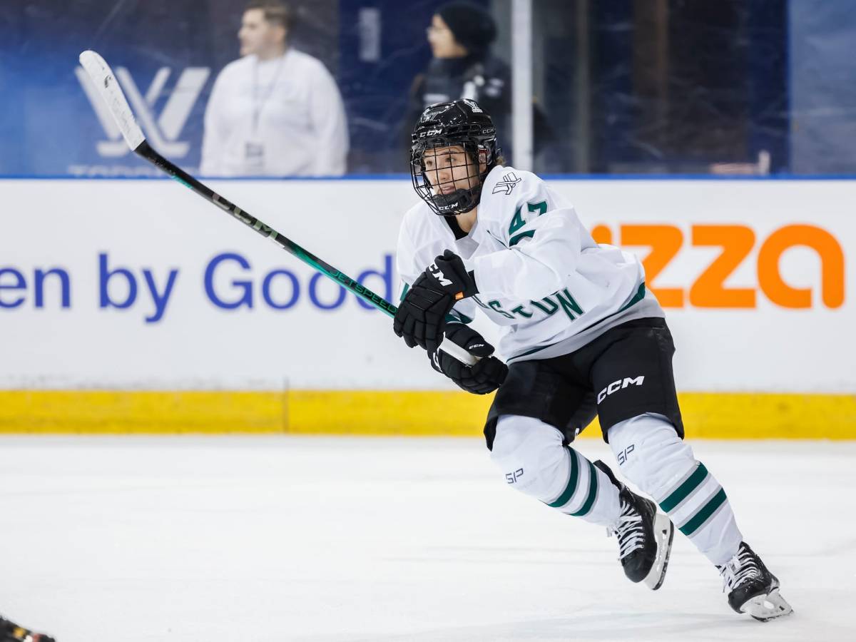 Jamie Lee Rattray, wearing her white away uniform, hunts the puck during a previous game.