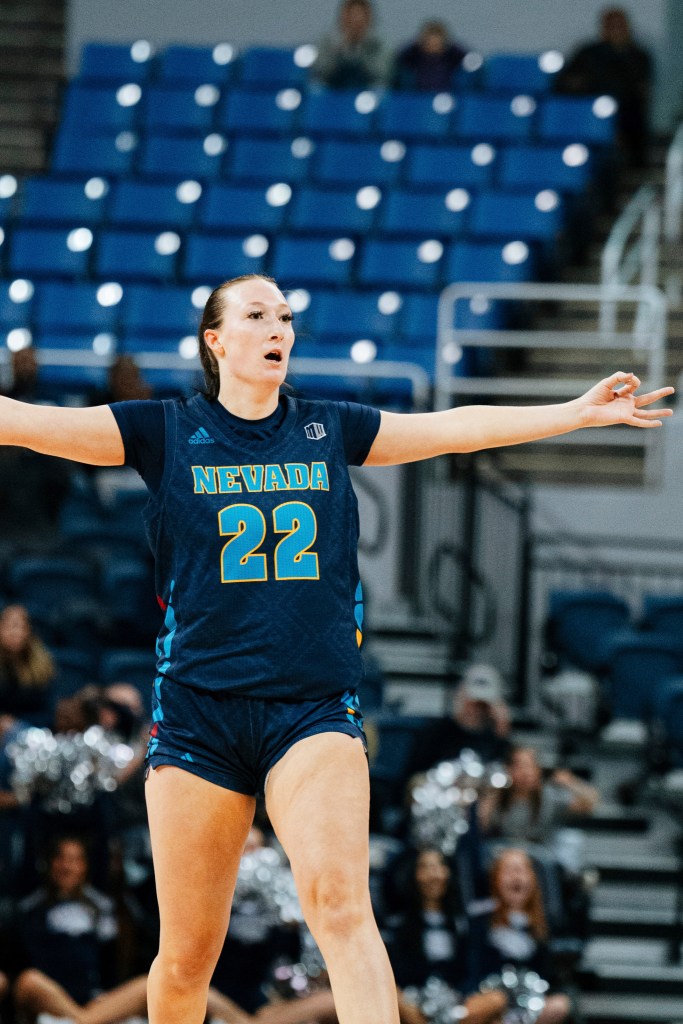 Nevada’s Claire Jacobs on the court with her arms outstretched