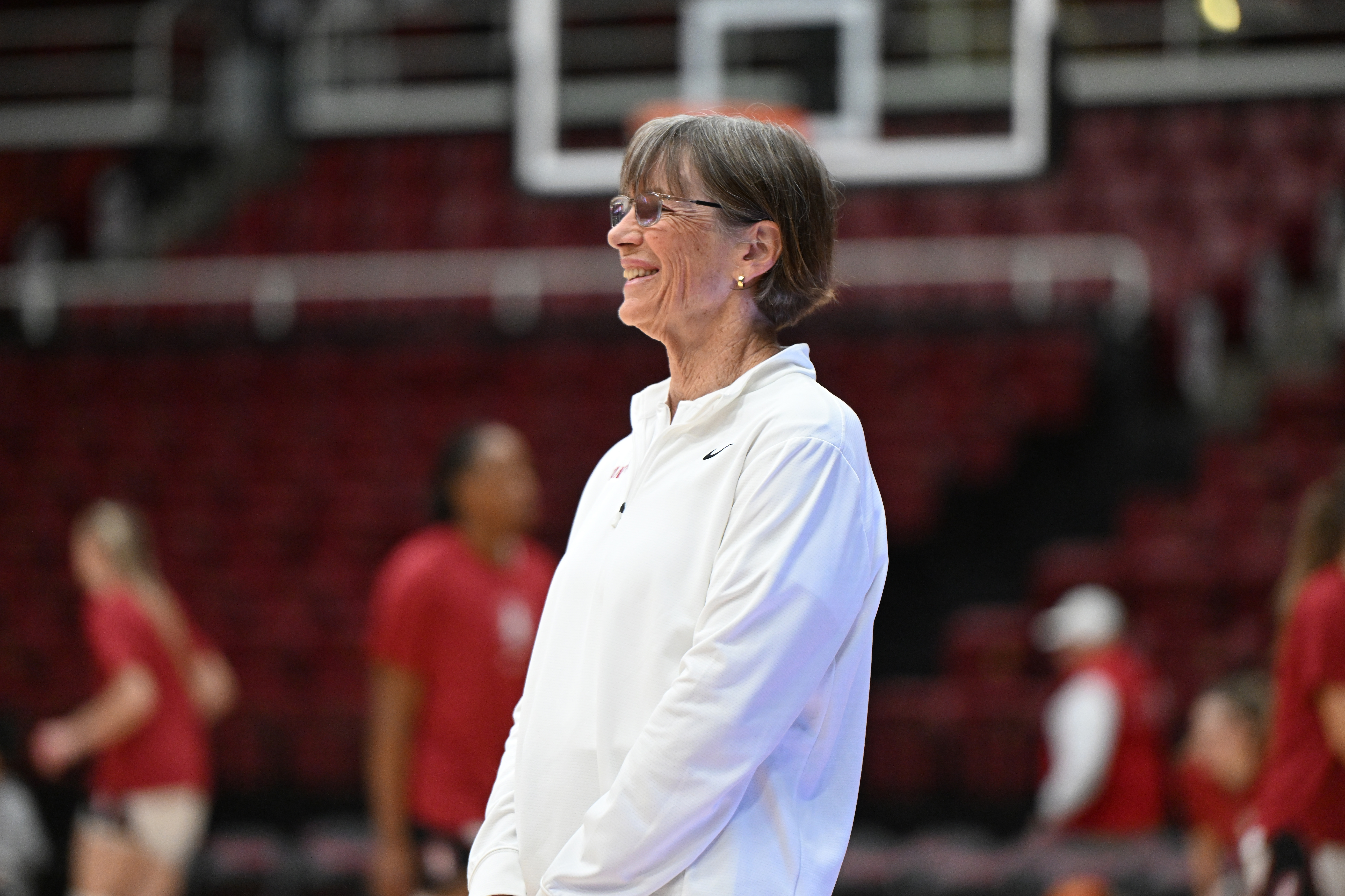 Tara VanDerveer smiles during team warmups before a game
