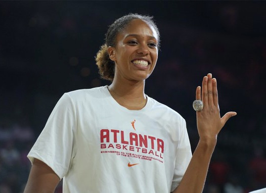 Iliana Rupert holds up her left hand to show off her 2022 WNBA championship ring in Las Vegas on Aug. 1, 2023.