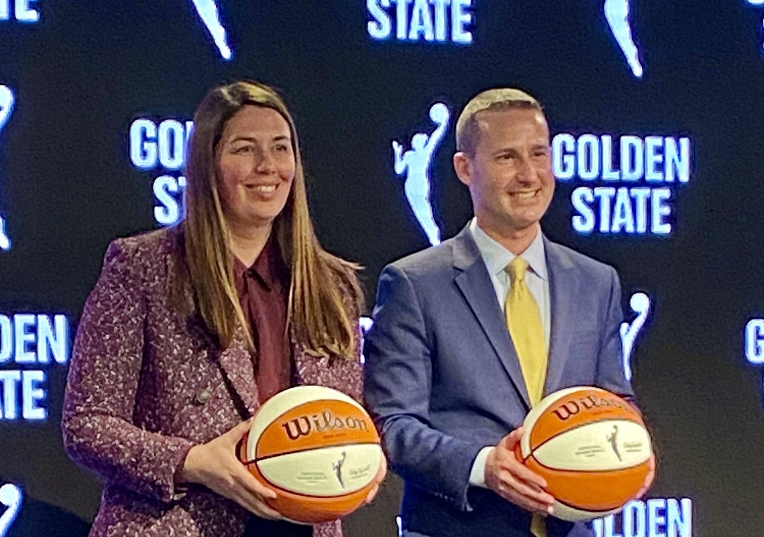 WNBA Golden State President Jess Smith poses with Warriors President Brandon Schneider Tuesday night.
