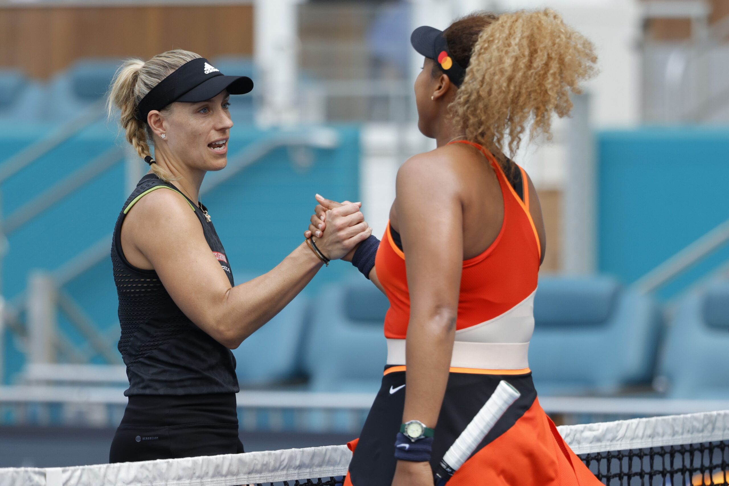 Mar 24, 2022; Miami Gardens, FL, USA; Naomi Osaka (JPN) (R) shakes hands with Angelique Kerber (GER) (L) after their second round women's singles match in the Miami Open at Hard Rock Stadium. Mandatory Credit: Geoff Burke-USA TODAY Sports