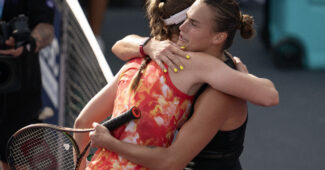 Elena Rybakina and Aryna Sabalenka hugging after playing a tennis match