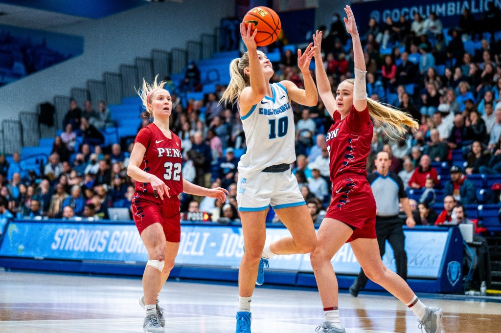 Columbia guard Kitty Henderson shoots a right-handed layup as two Penn defenders can't get there in time.