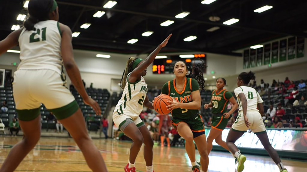 Ahriahna Grizzle of FAMU drives to the basket against Mississippi Valley defenders