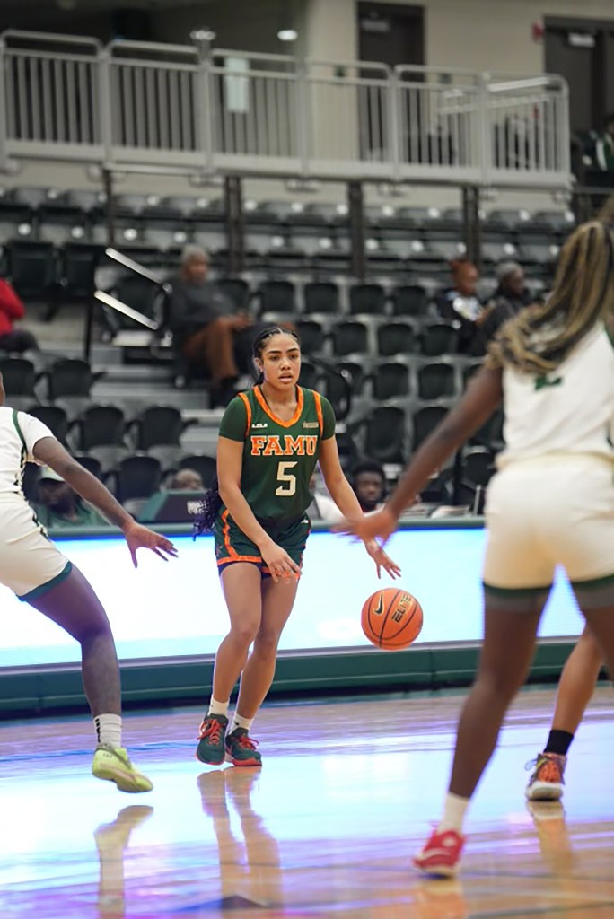 Ahriahna Grizzle dribbles the basketball