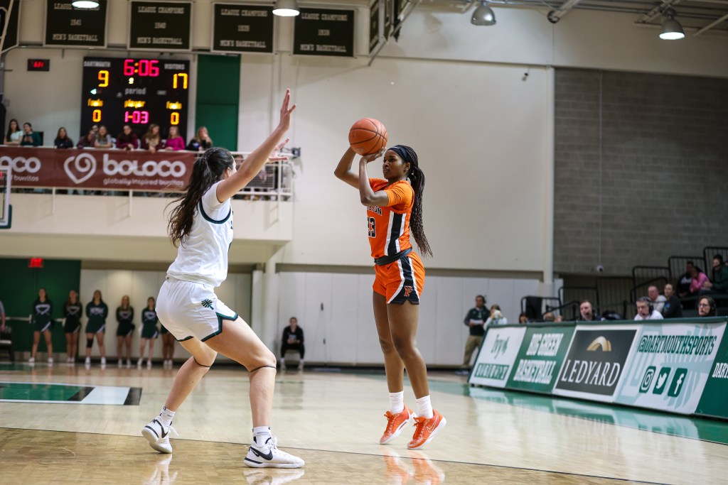 Princeton guard Madison St. Rose shoots a 3-pointer as a Dartmouth defender closes out with her hands up.