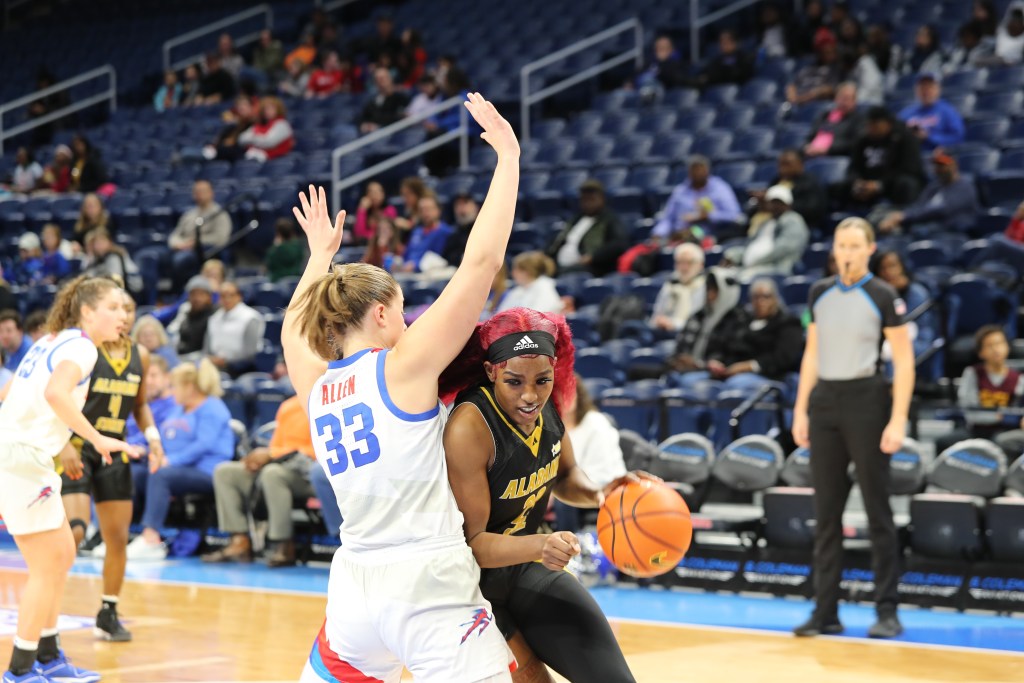 Alabama State’s Cordasia Harris dribbles the ball against a defender