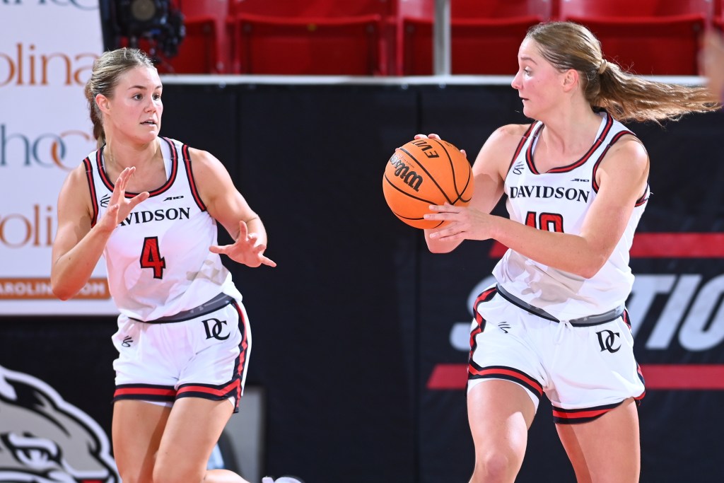 Millie Prior looks to pass to teammate Issy Morgan as they run up the court.