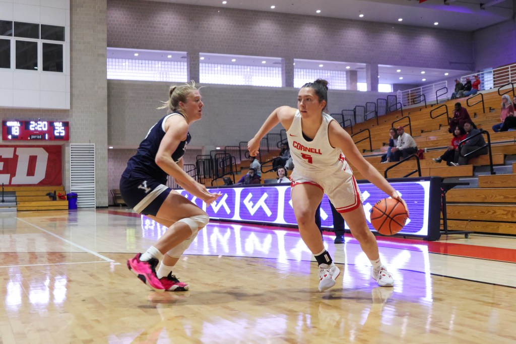 Cornell guard/forward Rachel Kaus drives the ball with her left hand near the baseline and inside the 3-point arc.