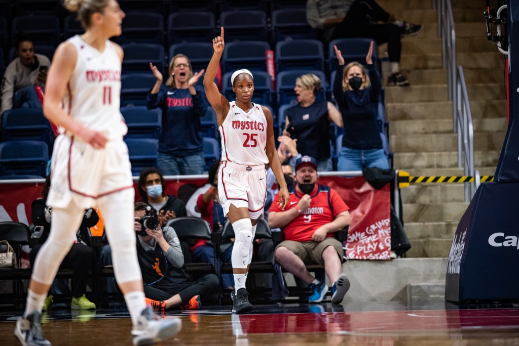 Kennedy Burke points her finger out to give credit