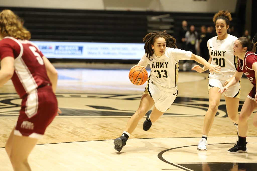 Army freshman Fiona Hastick dribbles the ball