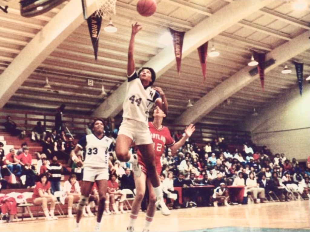 Cheyney State’s Yolanda Laney jumps for the ball near the basketball hoop