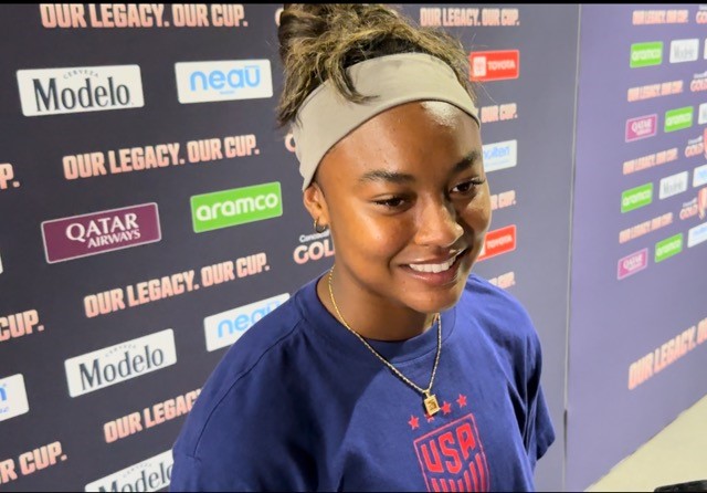 Jaedyn Shaw smiles in a blue USWNT shirt