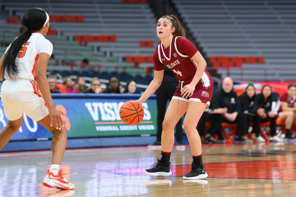 Colgate sophomore guard Madison Schiller dribbles the basketball against a defender