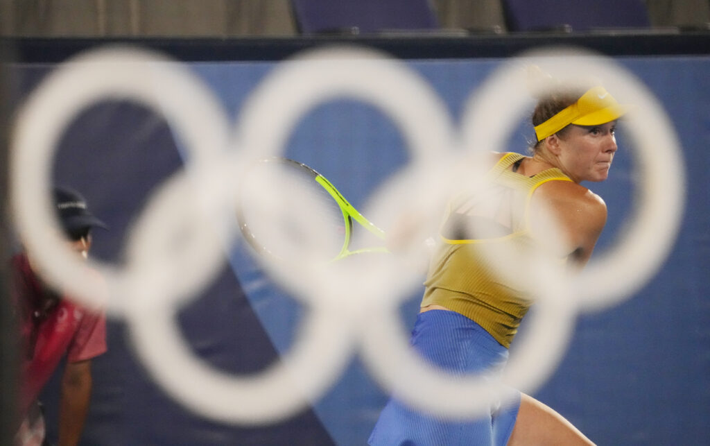 Elina Svitolina in the background of the Olympic Rings