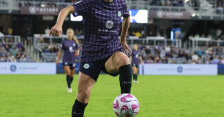 Racing Louisville FC midfielder Savannah DeMelo handles the soccer ball