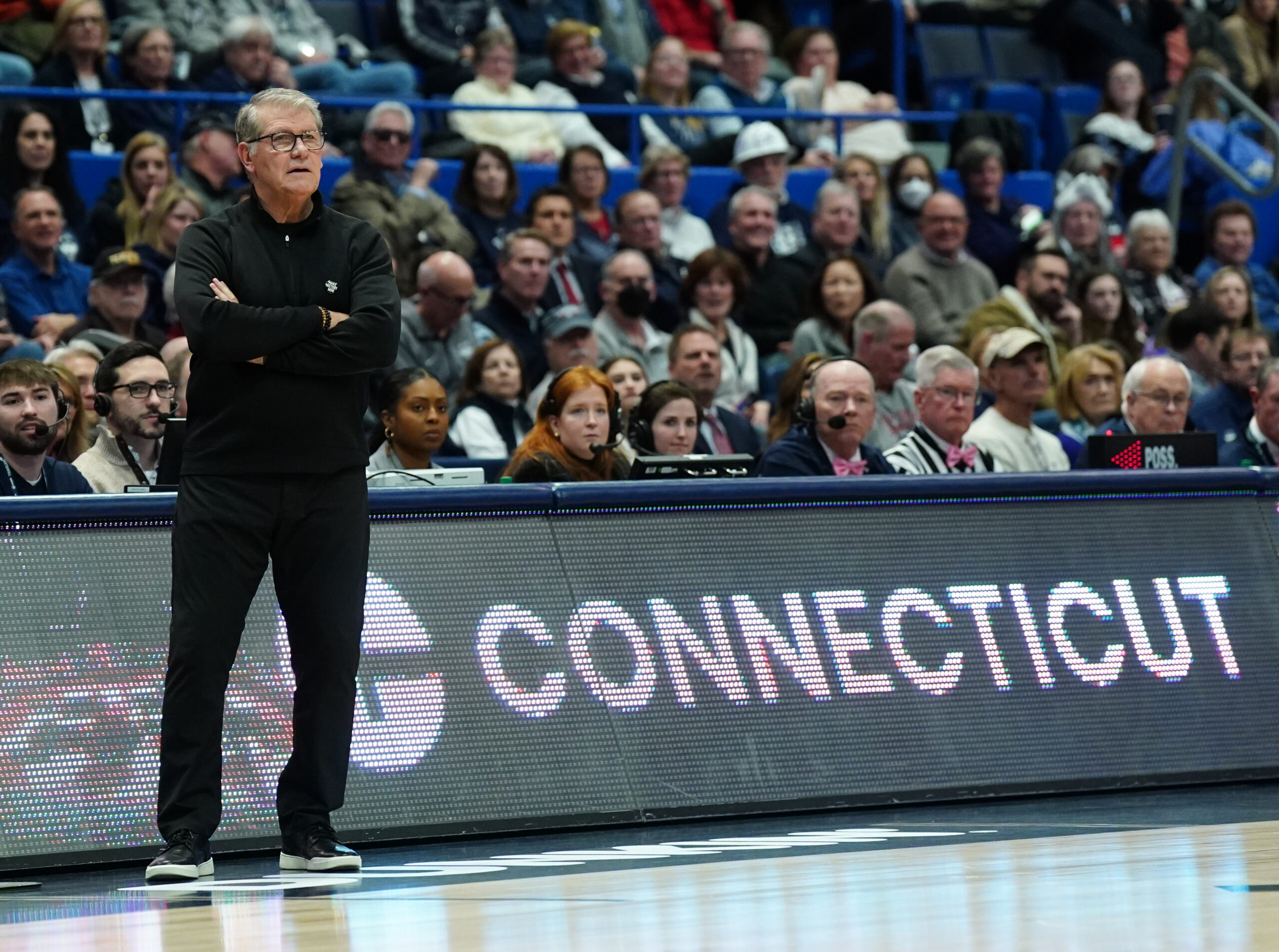 UConn Huskies head coach Geno Auriemma watches from the sideline