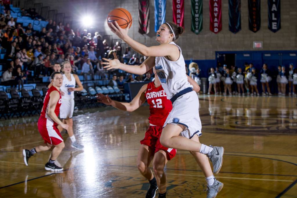 Columbia guard Camille Zimmerman looks at the basket and leans forward slightly as she gets past a defender for a left-handed layup.