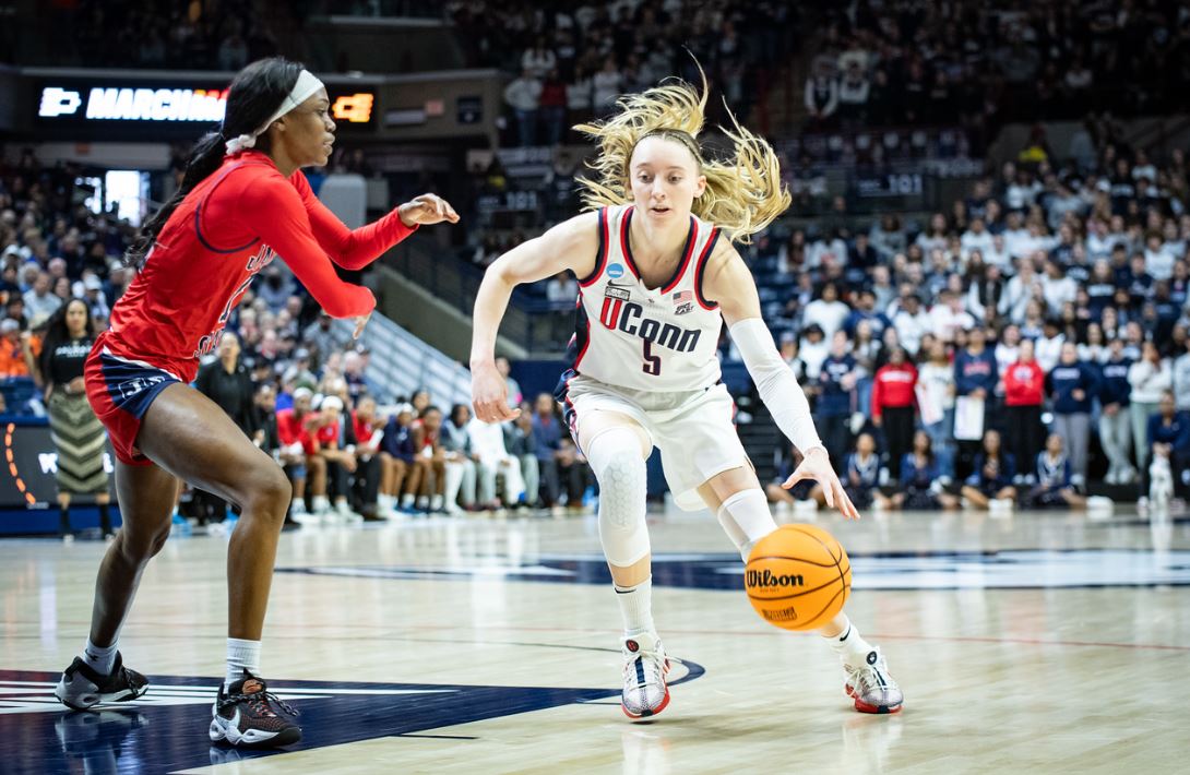 Paige Bueckers drives to the basket