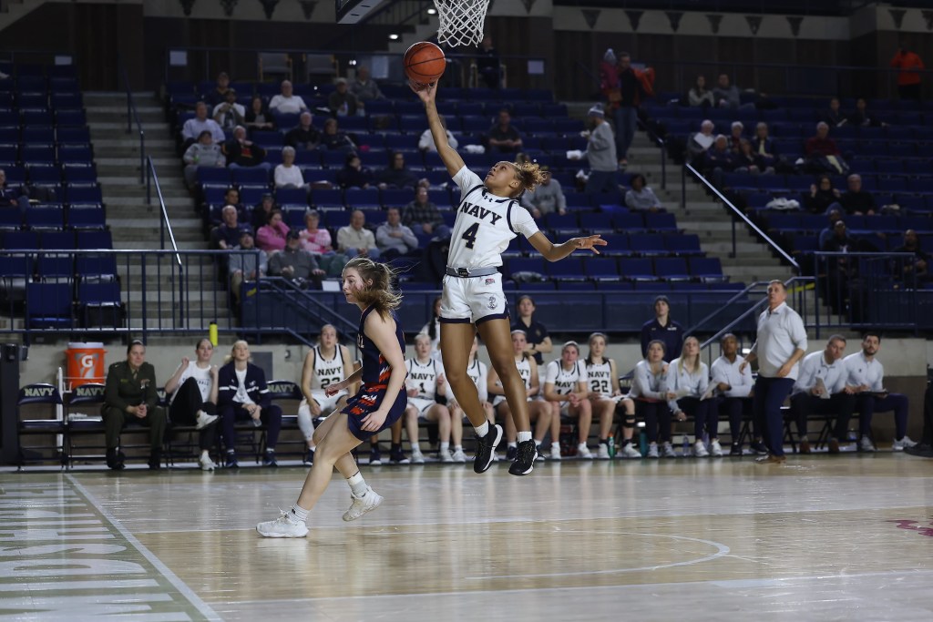 Navy’s Zanai Barnett-Gay takes the ball in for a layup