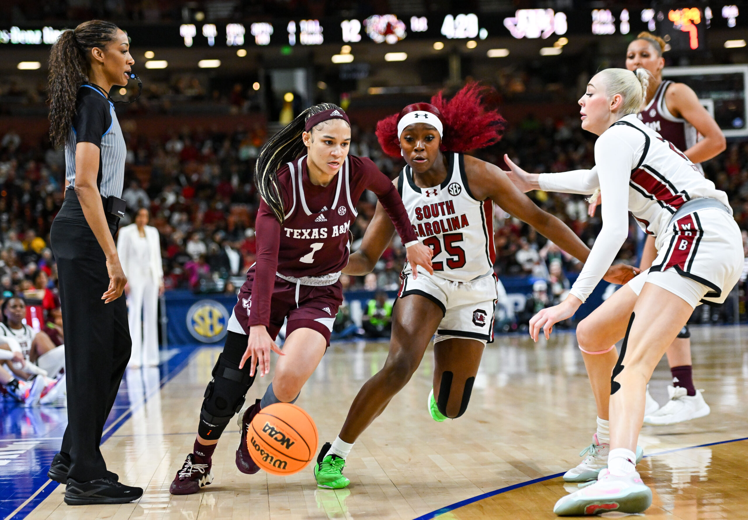 GREENVILLE, South Carolina - MARCH 08 - Texas A&M's Endyia Rogers (1) South Carolina's Raven Johnson (25) during the Women’s Basketball SEC Tournament between the South Carolina Gamecocks and the Texas A&M Aggies at Bon Secours Arena in Greenville, South Carolina on Friday, March 8, 2024. (Photo credit: Todd Van Emst, SEC)