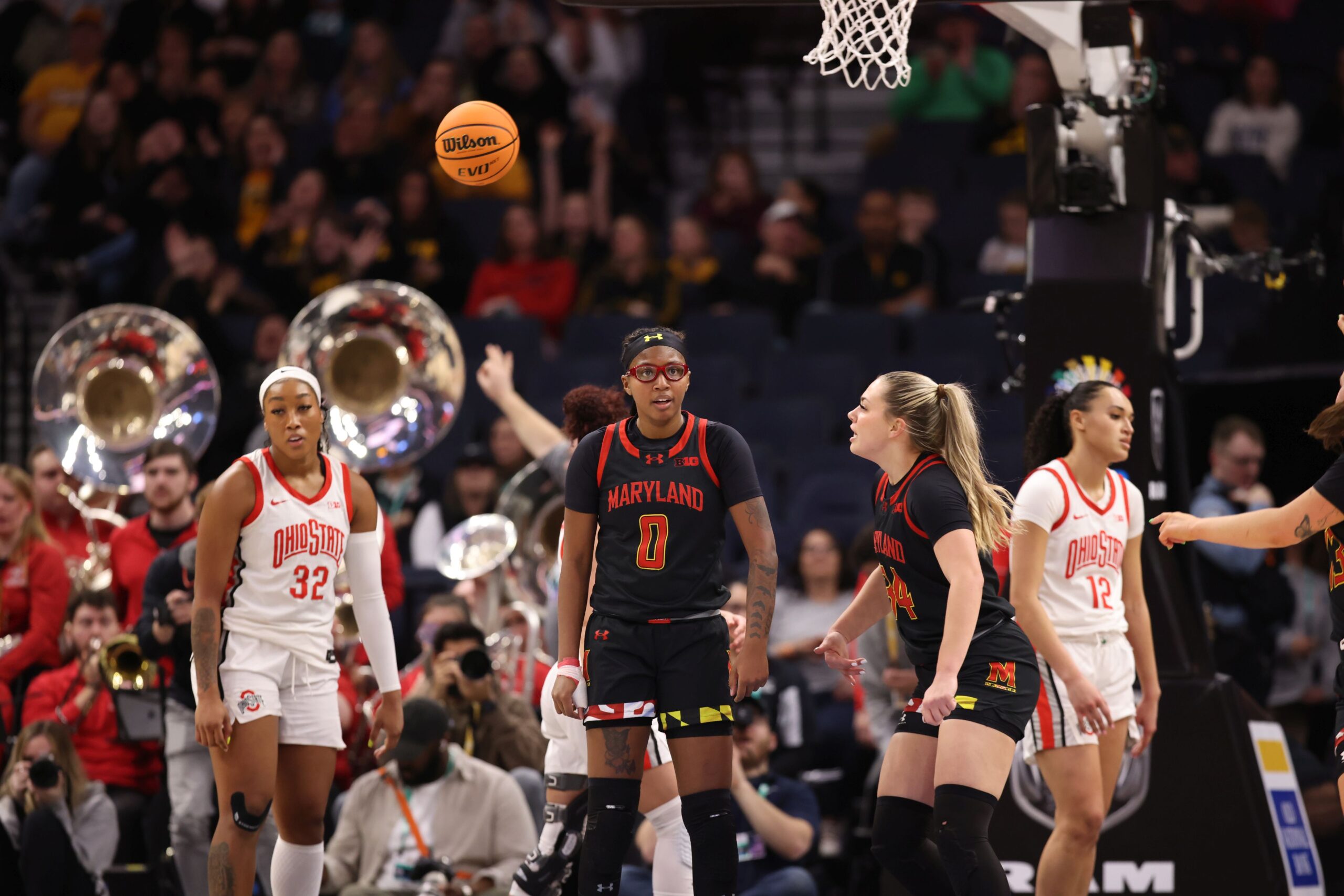 Maryland guard Shyanne Sellers looks straight ahead after a play as Ohio State defenders look dejected.