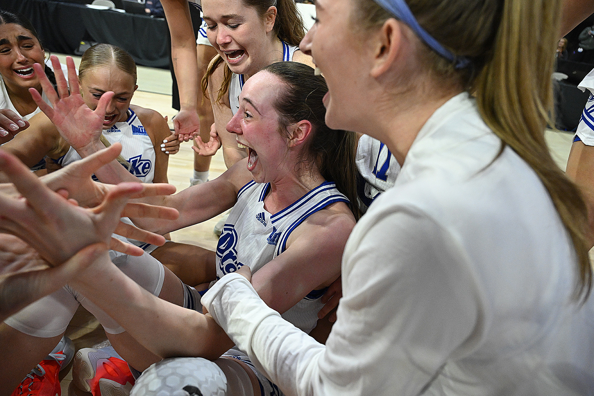 Drake's Anna Miller celebrates with her team.