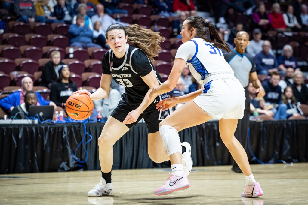 Georgetown’s Graceann Bennett dribbles the ball against a defender during the BIG EAST Tournament.
