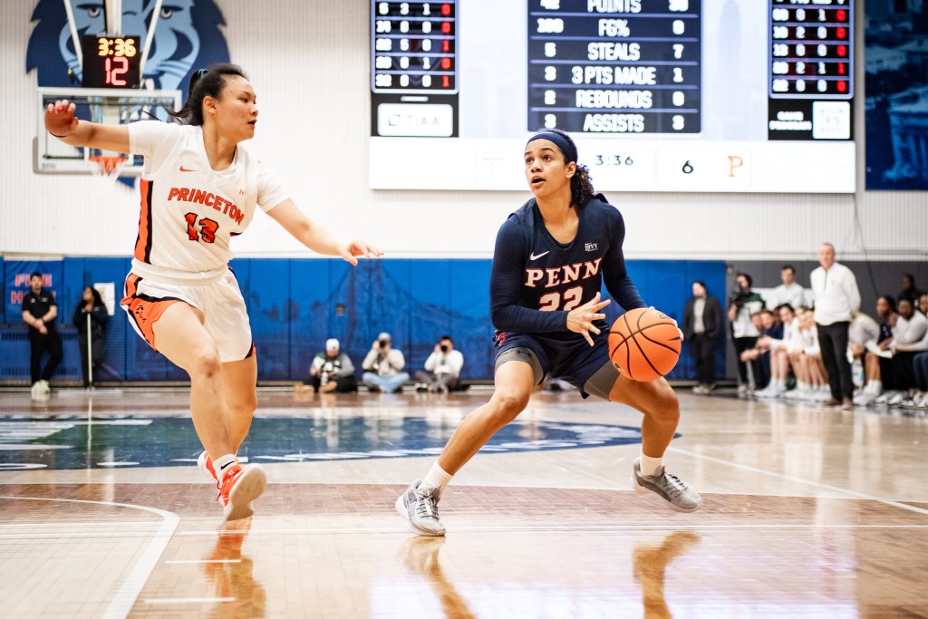 Penn point guard Mataya Gayle pushes off her right leg to try to get a stepback midrange jumper.