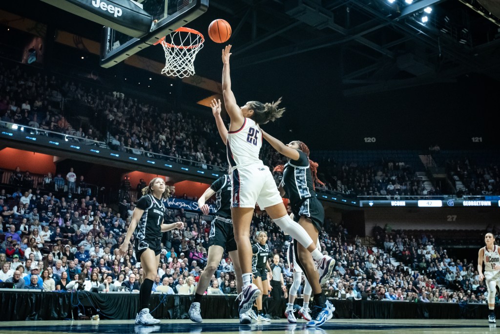 UConn forward Ice Brady drives to the basket