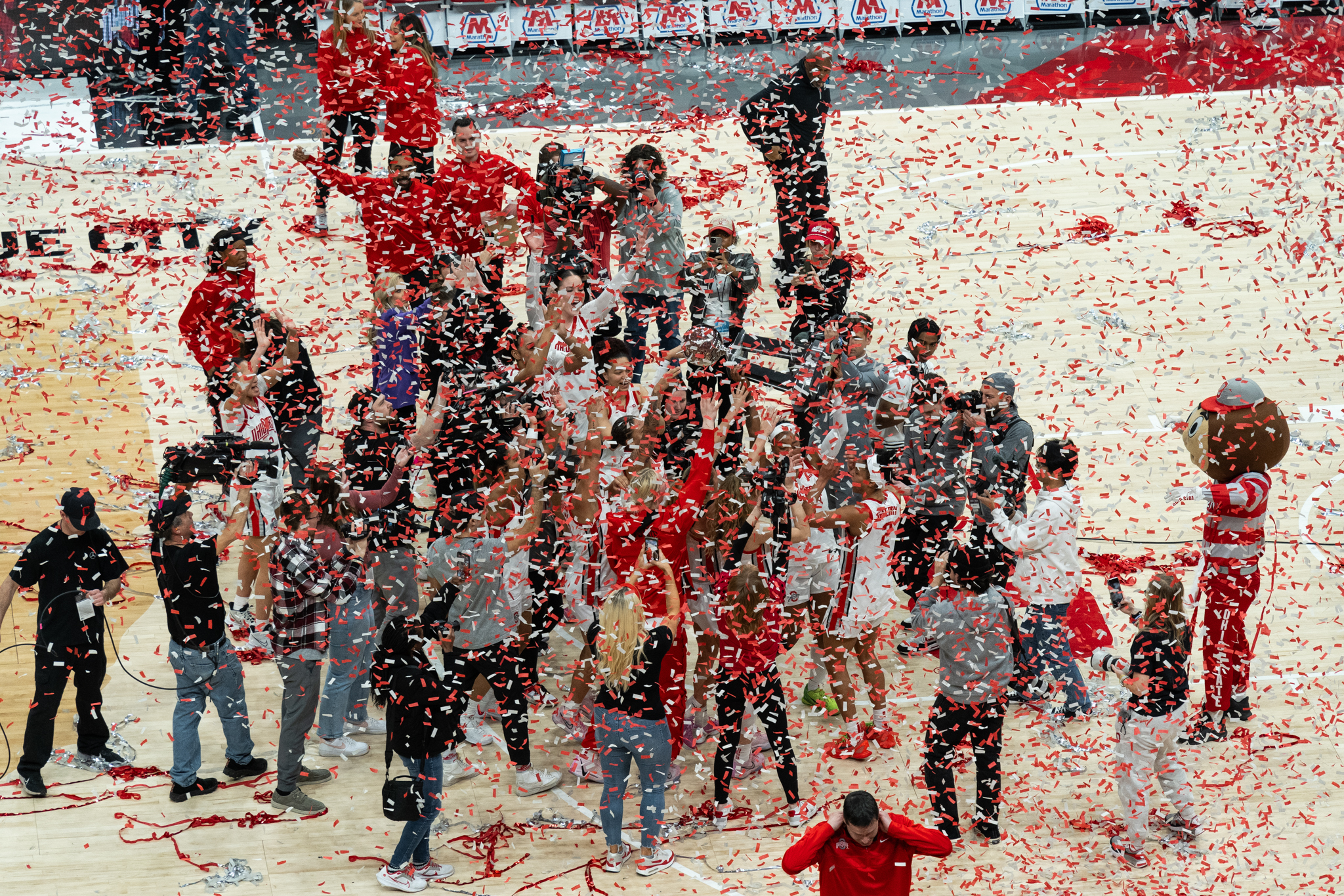 Red and white confetti falls on Ohio State as the Buckeyes celebrate their Big Ten regular-season title.