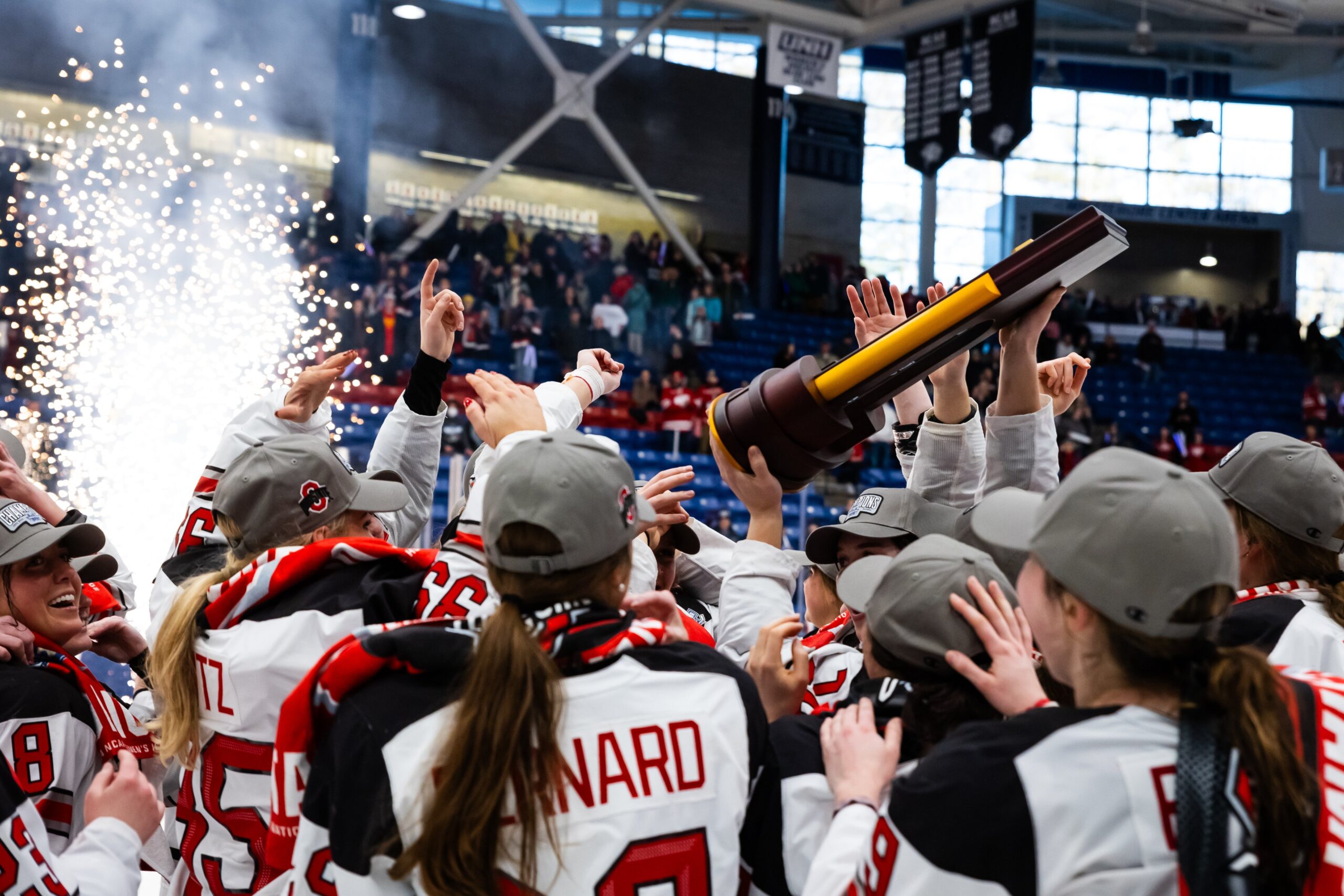 Hockey players from Ohio State hoist championship trophy