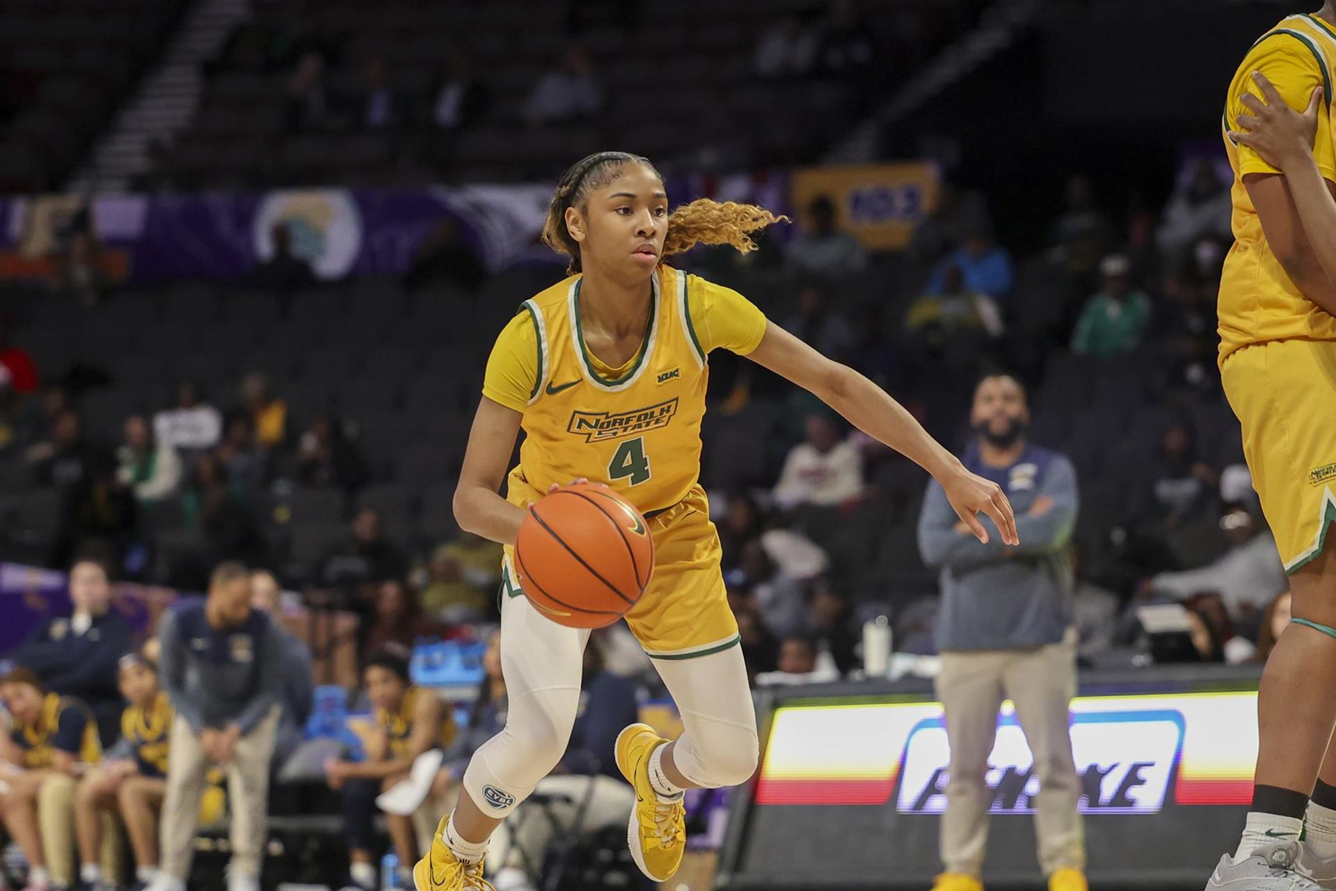 Norfolk State freshman guard Anjanae Richardson dribbles toward the viewer with her right hand.