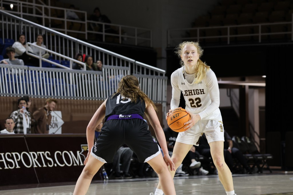 Lehigh’s Maddie Albrecht holds the basketball as a defender looks on