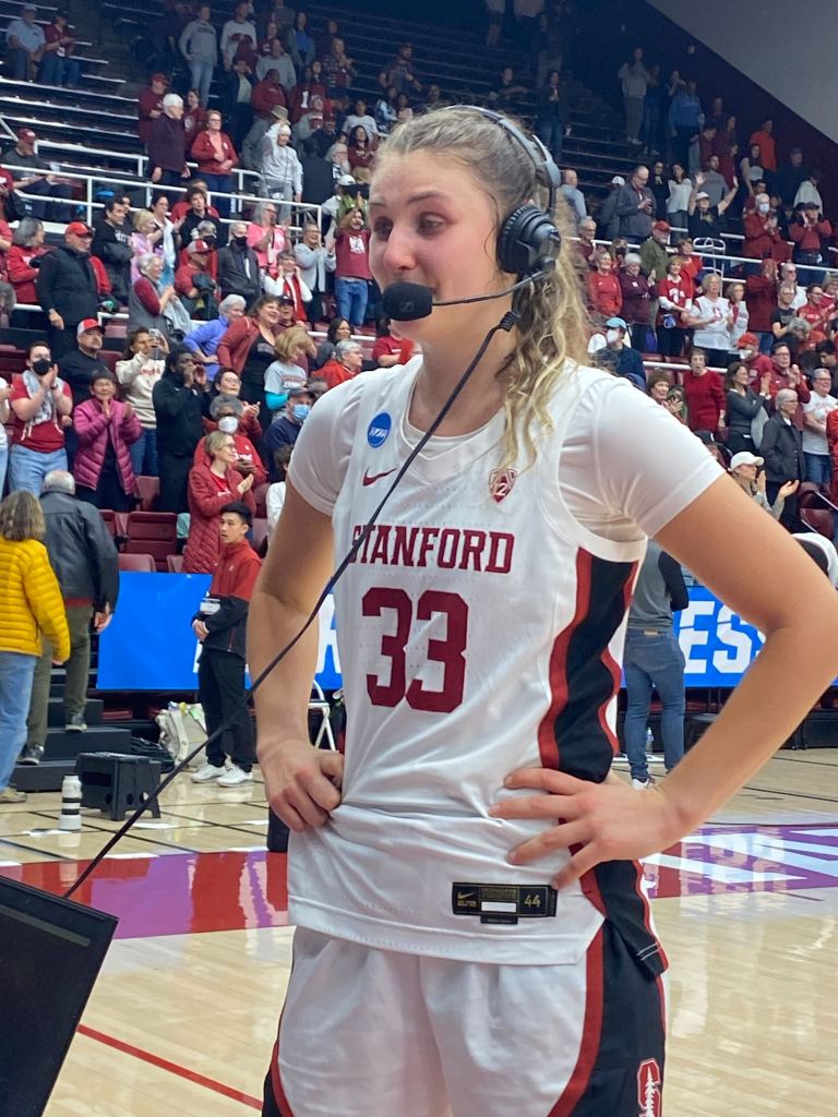 An emotional Hannah Jump, having just completed her final home game of her college career, does a postgame interview with Stanford's radio team after the Cardinal's 87-81 overtime win over Iowa State on March 24, 2024 at Maples Pavilion in Stanford, Calif. (Photo credit: Michelle Smith | The Next)