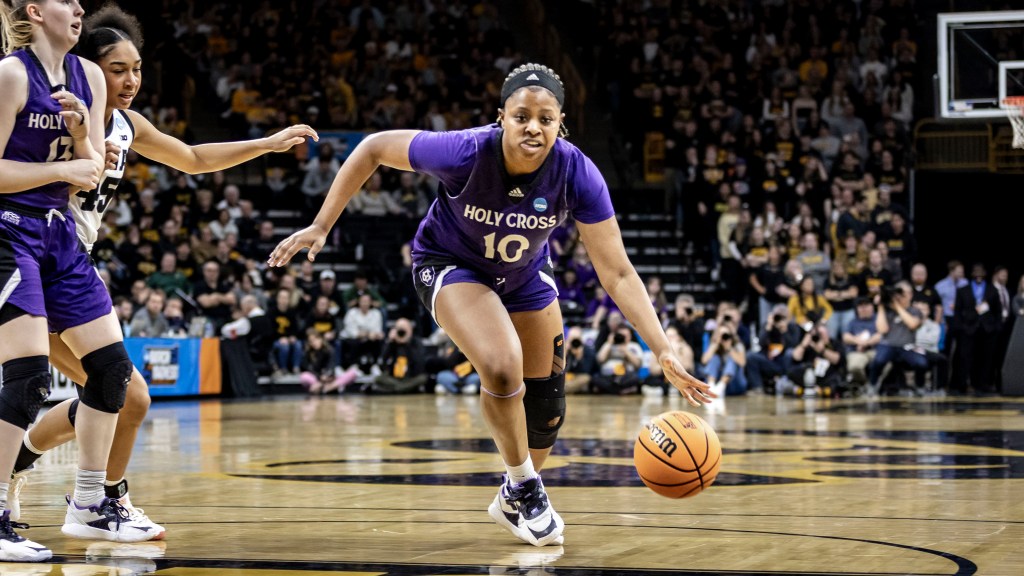 Holy Cross forward Janelle Allen drives to the hoop