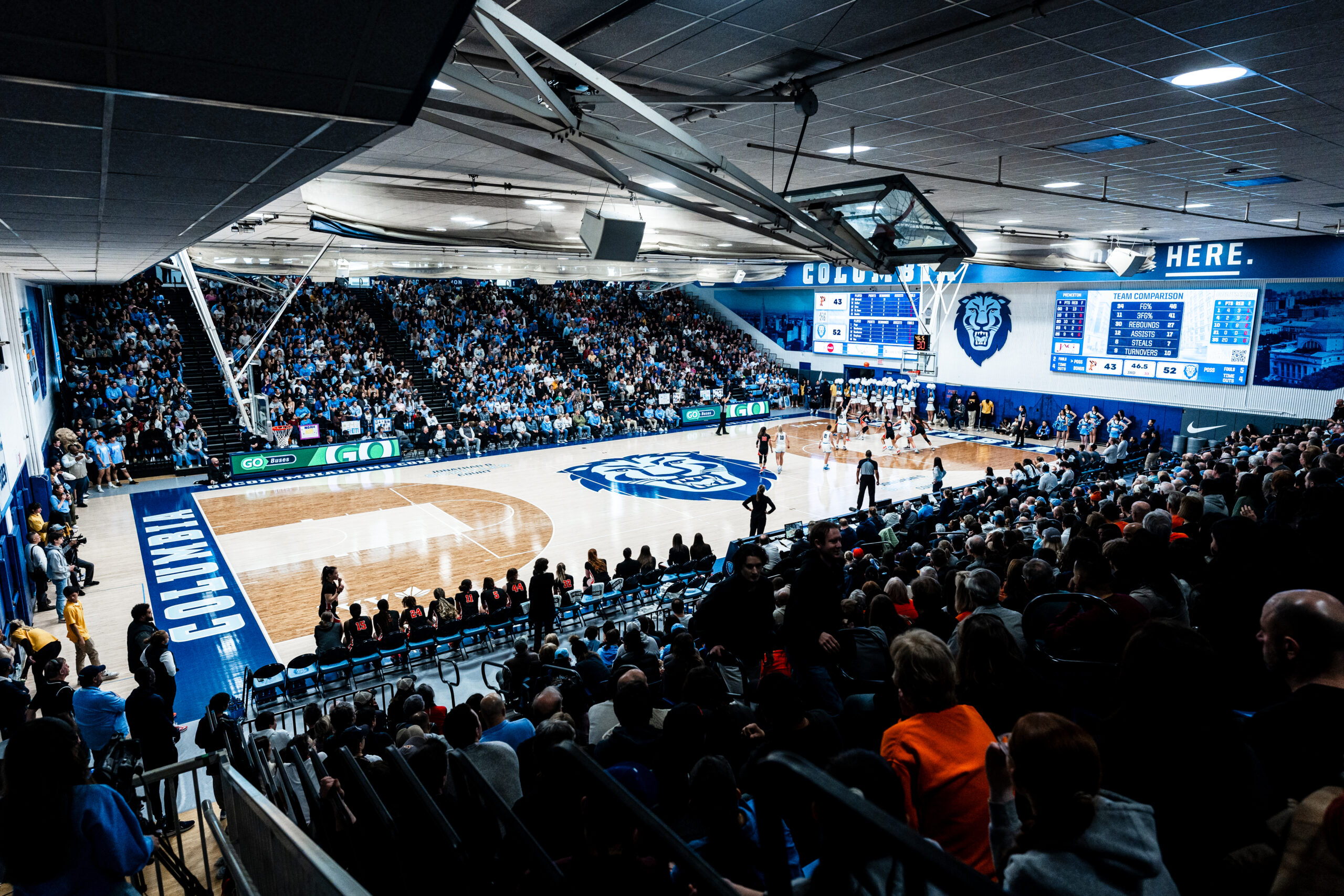 A zoomed-out view of the Levien Gymnasium court and capacity crowd.