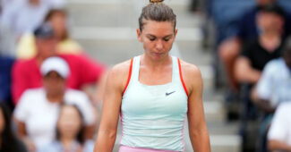Simona Halep looking down during her last professional match at the 2022 US Open.