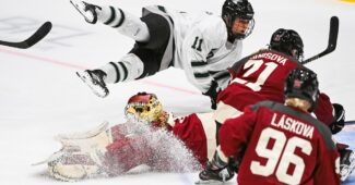 Jan 13, 2024; Montreal, Quebec, CANADA; Boston forward Alina Muller (11)flies in the air after a collision with Montreal goalie Ann-Renee Desbiens (35) during the second period in a PWHL ice hockey game at Verdun Auditorium. Mandatory Credit: David Kirouac-USA TODAY Sports