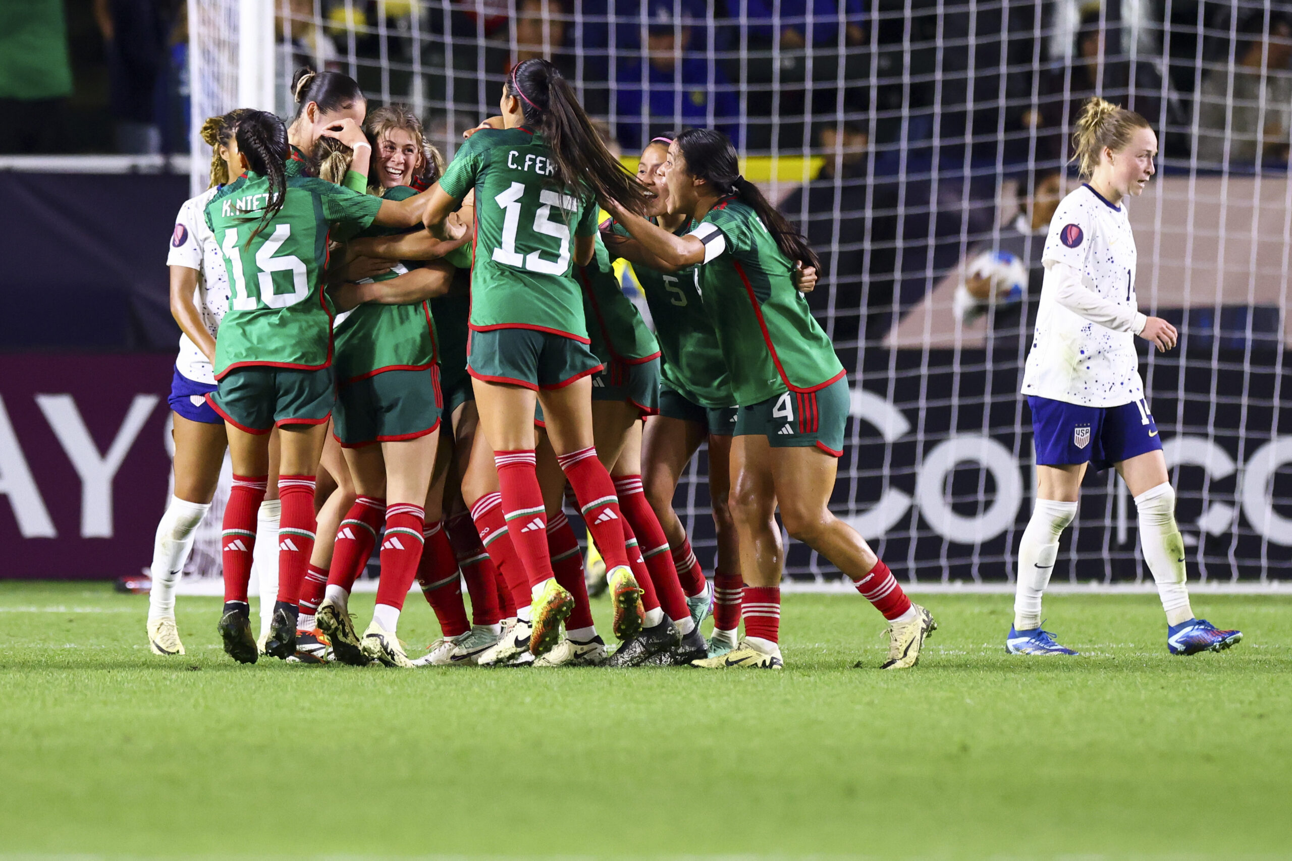 Mexico forward Mayra Pelayo celebrates with her teammates