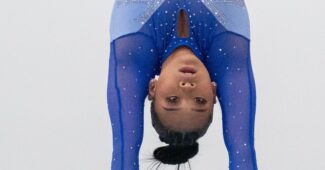Sunisa Lee competes on the uneven bars