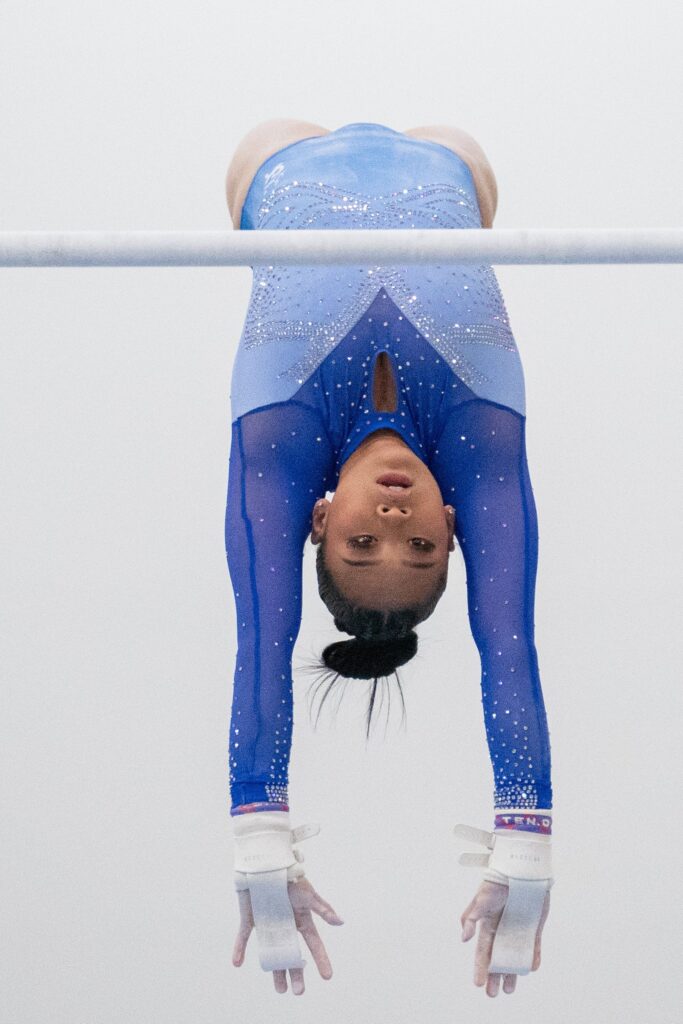 Sunisa Lee competes on the uneven bars