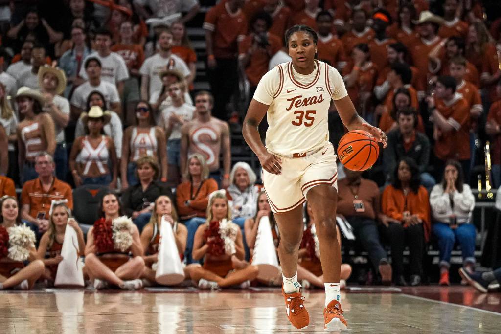 Texas guard Madison Booker (35) dribbles the ball towards the BYU basket during the basketball game at the Moody Center.