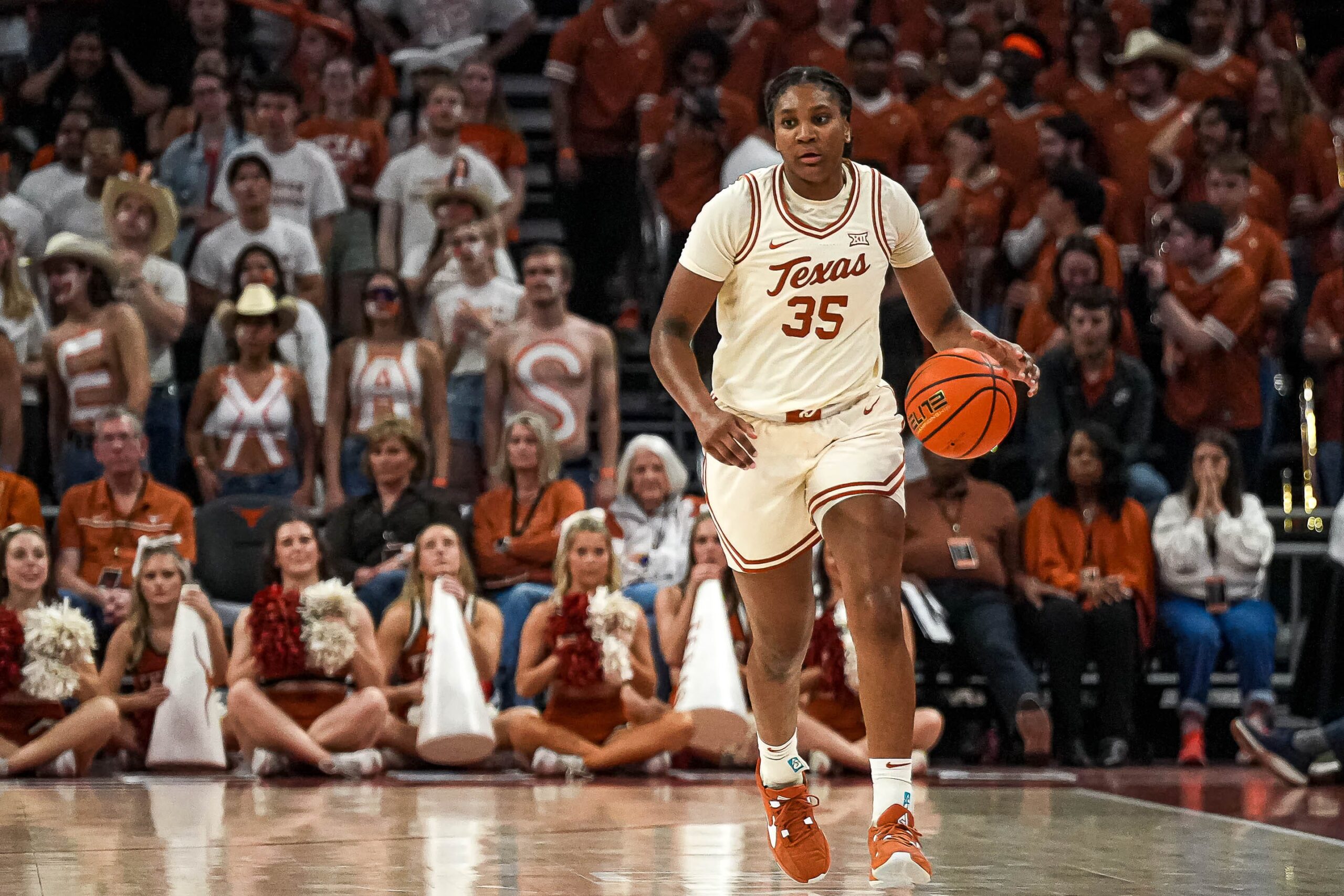 Texas guard Madison Booker (35) dribbles the ball towards the BYU basket during the basketball game at the Moody Center.