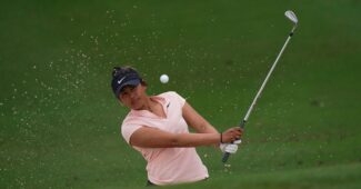 Amari Avery hitting out of a bunker during a practice round at the Augusta National Women's Amateur.